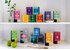 On display are all the tea packages of the Happiness Is series. They are placed on a shelf and are divided on two floors.