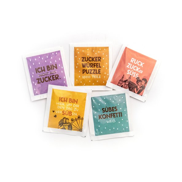 The photo shows colorful beet sugar portion packs.