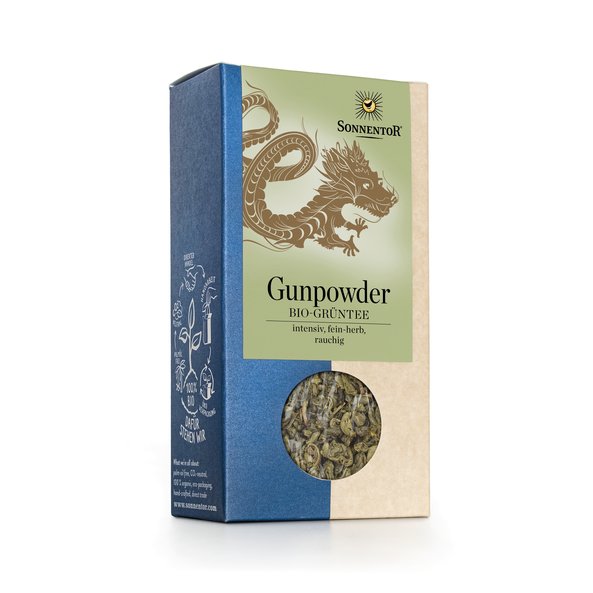 Photo of a pack of SONNENTOR Gunpowder Chinese Green Tea loose. There is an elaborate illustration of a dragon on the package.