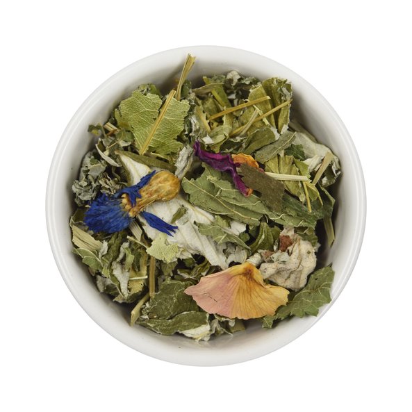 Photo of a small bowl filled with the loose Pleasant Leisure Time Herbal Tea from SONNENTOR.