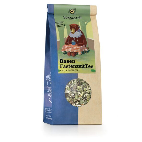 Photo of a pack Base FastingTea loose Organic Herbal Tea. On the package is a picture of a bear sitting at a table in the woods, holding a knife and fork in his hand and and having a cup of hot tea in front of him at the table.