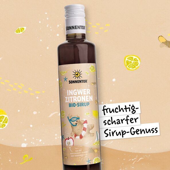 Sonnentor Ingwer-Zitronen Bio-Sirup Flasche, Illustration mit Zitrone und Text „fruchtig-scharfer Sirup-Genuss“