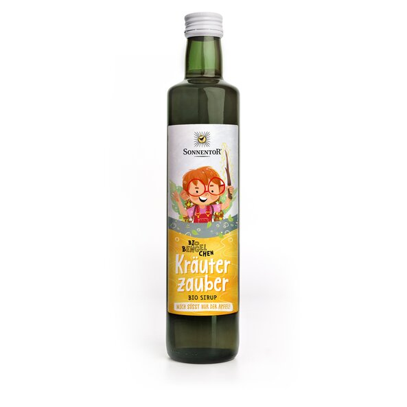 Photo of a bottle herb magic syrup. On the bottle is a girl with red glasses and a stick in her hand depicted. Various herbs are flying through the air.