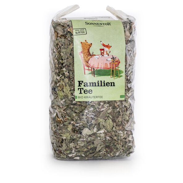 Photo of a pack FamilyTea loose Organic Herbal Tea Blend. On the package is a picture of a bear, a fox and a mouse sitting together at the table.