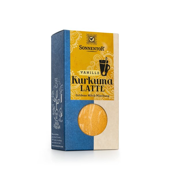 Foto einer Packung Kurkuma Latte Vanille. Auf der Packung ist ein gelbes Etikett auf dem groß Kurkuma Latte steht.