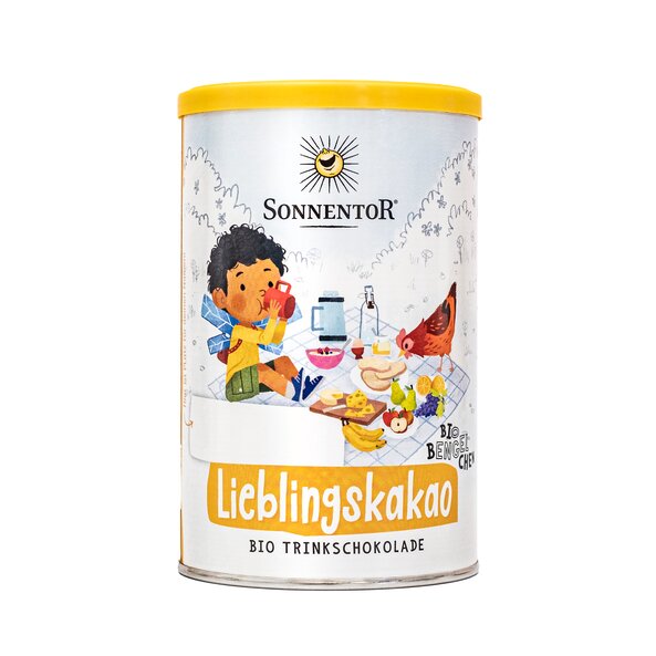 Photo of a tin drinking chocolate powder. On the can is Bengelchen Moritz during a picnic depicted.