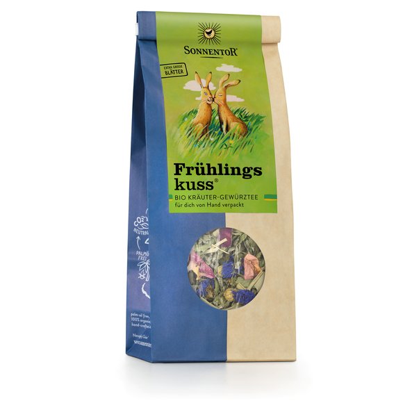 Photo of a pack spring kiss herbal tea loose. On the package is a picture of two rabbits sitting in the tall grass kissing each other on the cheek.
