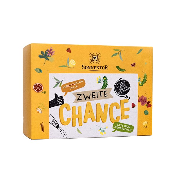 Foto von der Zweiten Chance Box. Die Box ist gelb und mit verschiedensten Kräutern verziert.