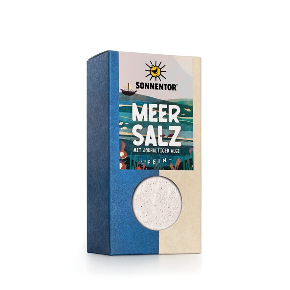 Square box with a label that says "Sea Salt with algae containing iodine - fine". A sea with algae can be seen and a sailing ship.