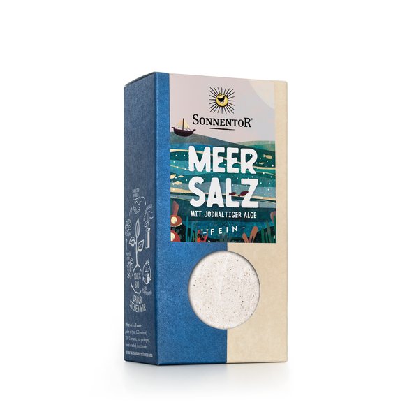 Square box with a label that says "Sea Salt with algae containing iodine - fine". A sea with algae can be seen and a sailing ship.
