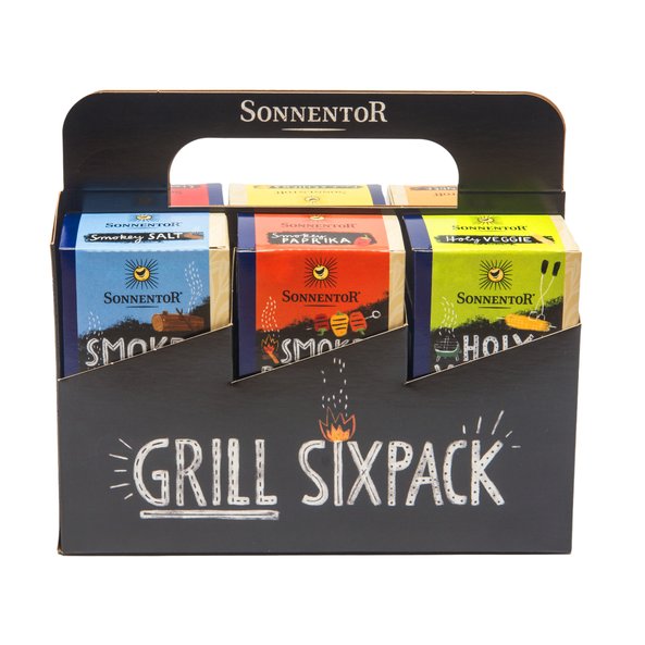 Photo of a six-pack. There are three barbecue spices on each side. The pack is black and the spice packs have different colors.