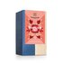 In the photo you can see a pack family time tea. On it are flowers and leaves depicted.
