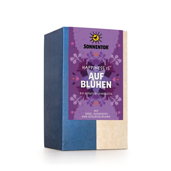 Photo of a pack Blossoming Tea Organic Herbal Spice Tea Blend. On the package is an illustration with floral background in violet turquoise with the inscription Happiness is blossoming.
