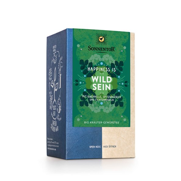 Photo of a pack Free Spirit Tea Organic Herbal Spice Tea Blend. On the package is an illustration with floral background in dark green with the inscription Happiness is Free Spirit Tea.