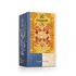 Photo of a pack Feeling Wide Awake Tea Organic Spice Tea Blend with Mate, caffeinated. On the package is an illustration with floral background in yellow-orange with the inscription Happiness is Feeling Wide Awake Tea.