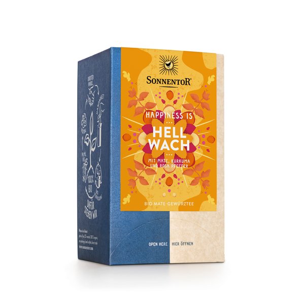 Photo of a pack Feeling Wide Awake Tea Organic Spice Tea Blend with Mate, caffeinated. On the package is an illustration with floral background in yellow-orange with the inscription Happiness is Feeling Wide Awake Tea.