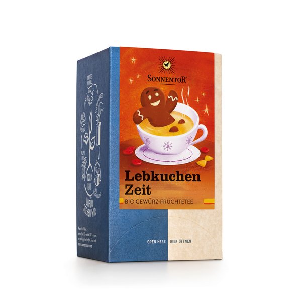 Photo of a pack Gingerbread Time Tea Organic Spice Fruit Tea Blend. On the package is an illustration of a happy gingerbread male bathing in a hot cup of tea.