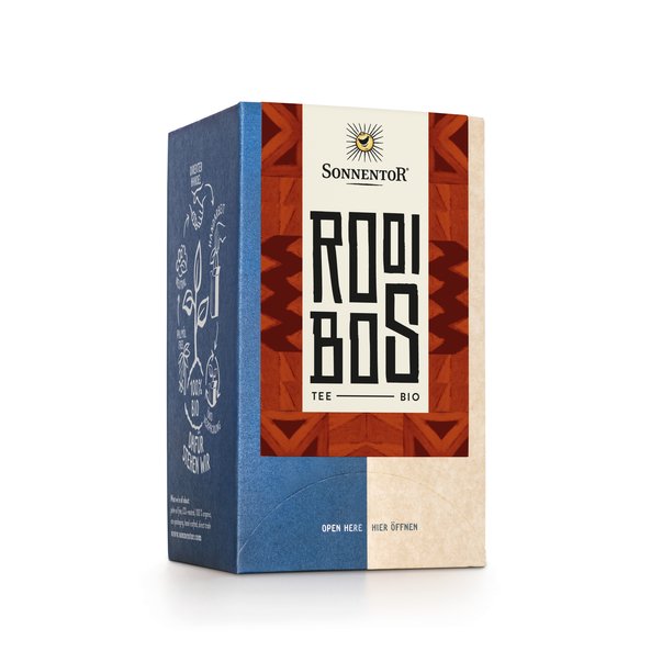 Foto einer Packung Rooibos Tee. Auf der Packung ist eine Illustration mit einem braunen Muster als Hintergrund und der Aufschrift Rooibos.
