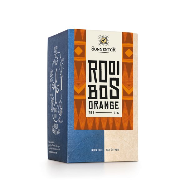 Foto einer Packung Rooibos Tee Bio-Rooibos-Früchteteemischung mit ätherischem Orangenöl aromatisiert. Auf der Packung ist eine Illustration mit einem orangenen Muster als Hintergrund und der Aufschrift Rooibos Orange.
