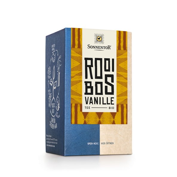 Foto einer Packung Rooibos Vanille Tee. Auf der Packung ist eine Illustration mit einem gelben Muster als Hintergrund und der Aufschrift Rooibos.