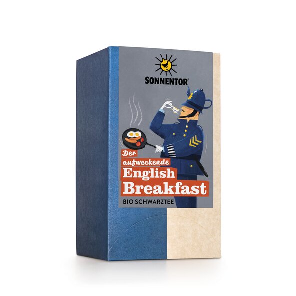  An English soldier in blue uniform with a teapot as a hat on his head is drinking a cup of tea and holding a pan with sausages and fried eggs in it.