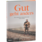 A picture of the book Gut geht anders. The cover shows Johannes Gutmann in the nature in front of train rails.