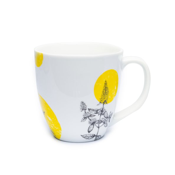 In the picture you can see the herbal stitches tea cup. On it are yellow circles and herbs depicted.