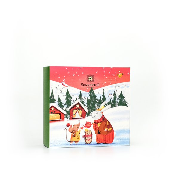 In the photo you can see the gift box Christmas. On it is a winter landscape with a bunny and a mouse depicted.
