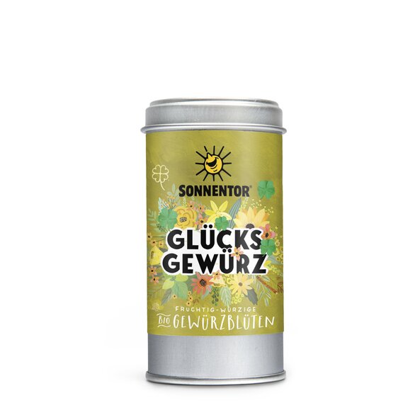 Foto einer Streudose Glücks Gewürzblüten. Auf der Streudose ist eine Illustration mit buntem, blumigem Hintergrund in grün mit der Aufschrift Glücks Gewürz.
