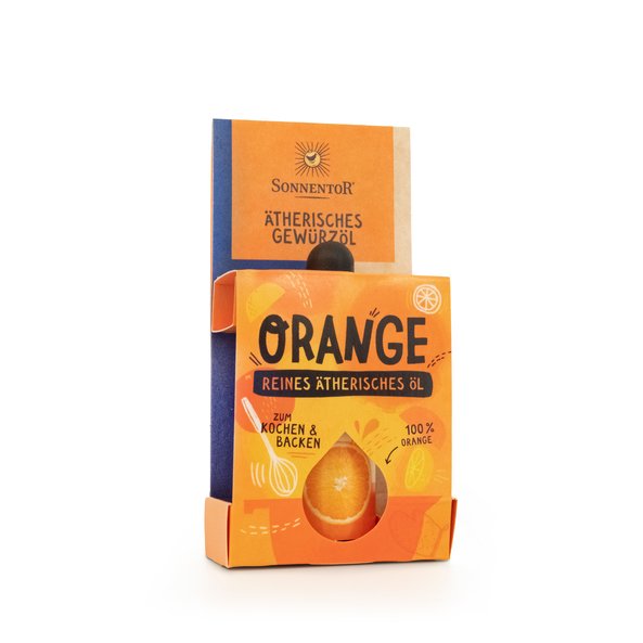 An orange colored package in which you can see the spice oil. On the package you can see a bowl, orange slices and a whisk.