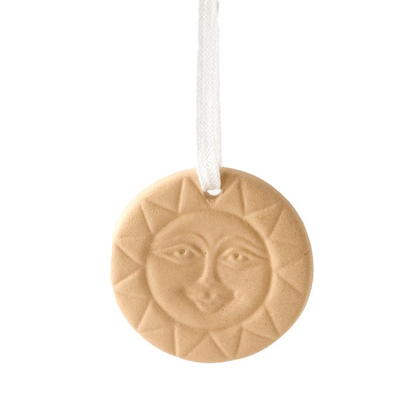A fragrance sun-shaped stone . At the top it has a hole and band for hanging.