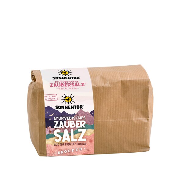 Photo of a brown gianz-size pack of Ayurvedia Magic Salt. On the package is a label on the mountain in bright colors.