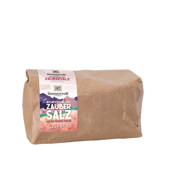 Photo of a brown gianz-size pack of Ayurvedia Magic Salt. On the package is a label on the mountain in bright colors.