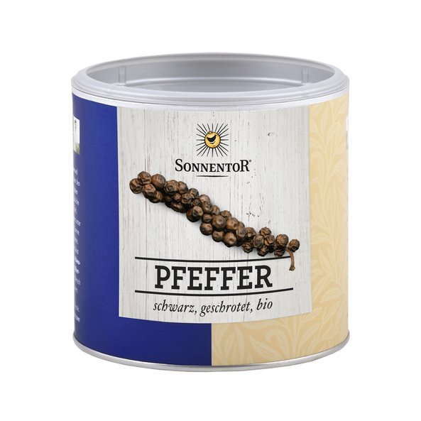 A small jumbo spice tin of pepper black shredded. On the tin you can see peppercorns.