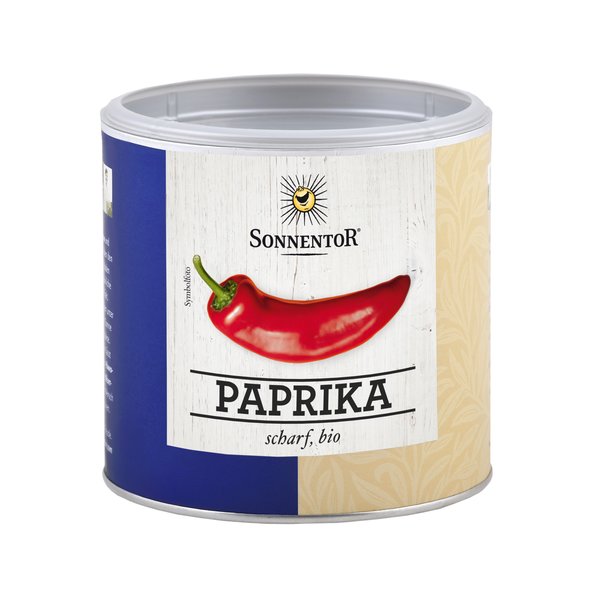A photo of a small jumbo spice tin of hot peppers. On the can is pepper depicted.