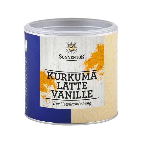 A photo of a small jumbo spice tin of turmeric latte vanilla. On the tin you can see the orange colored spice mixture.