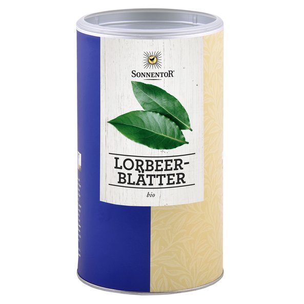 A photo of a big jumbo spice tin with bay leaves whole. On the tin are two bay leaves depicted.